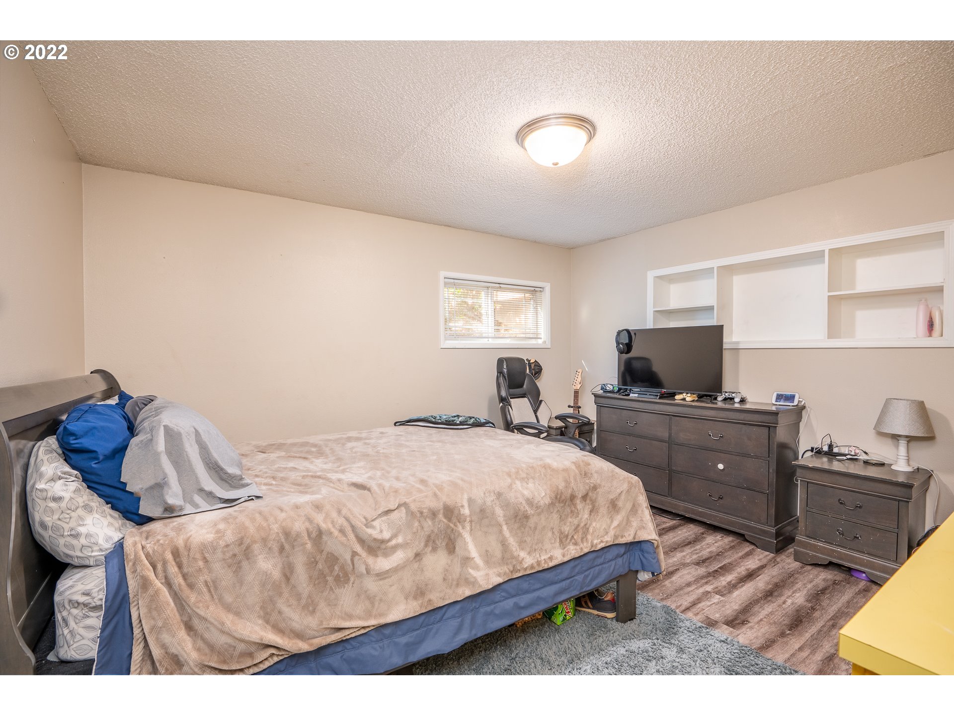 39845 Deerhorn Road Springfield, OR 97478 - Photo 21 of 29 a bedroom with a bed and a flat screen tv