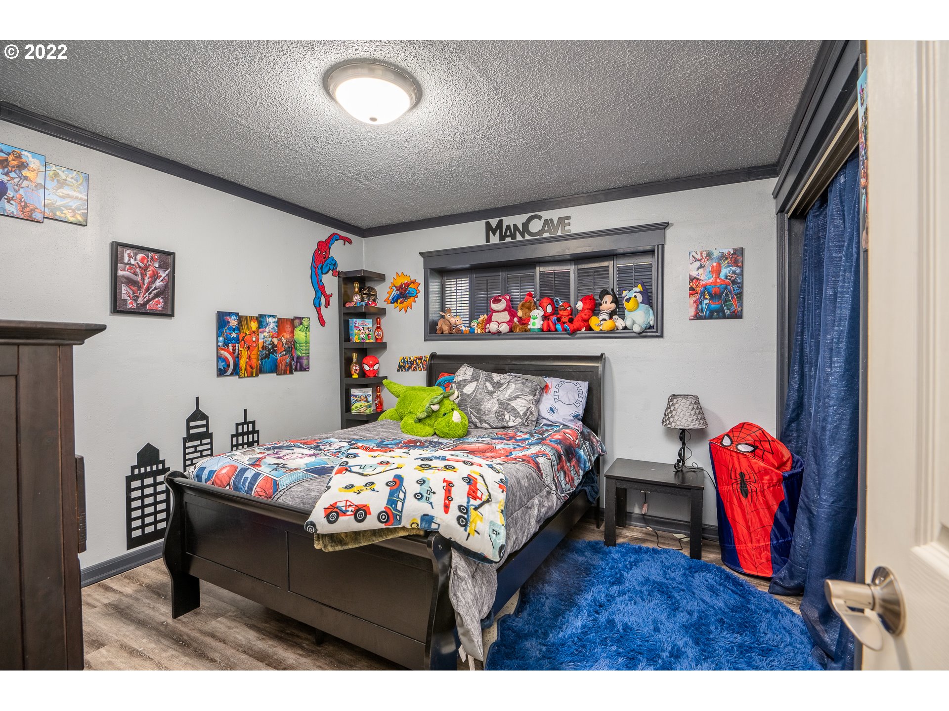 39845 Deerhorn Road Springfield, OR 97478 - Photo 22 of 29 a bedroom with a bed a dresser and a book shelf