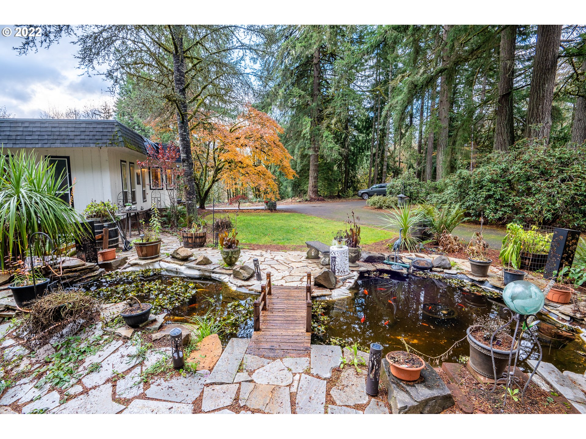 39845 Deerhorn Road Springfield, OR 97478 - Photo 29 of 29 a front view of a house with garden and sitting area