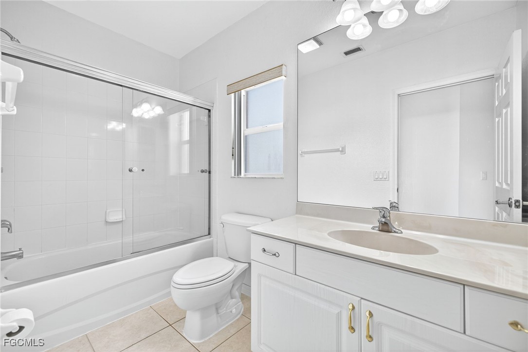 2007 Southwest 43rd Terrace Cape Coral, FL 33914 - Photo 17 of 22 a bathroom with a sink a toilet and shower