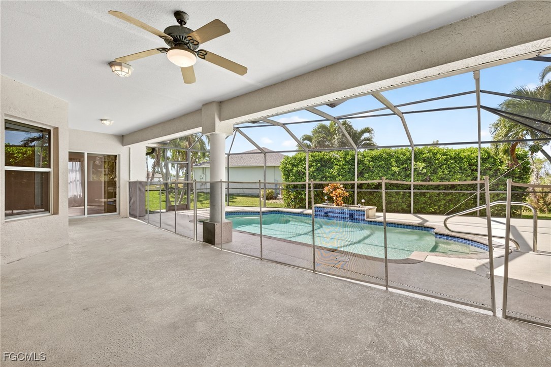 2007 Southwest 43rd Terrace Cape Coral, FL 33914 - Photo 21 of 22 a view of a livingroom with furniture and floor to ceiling window