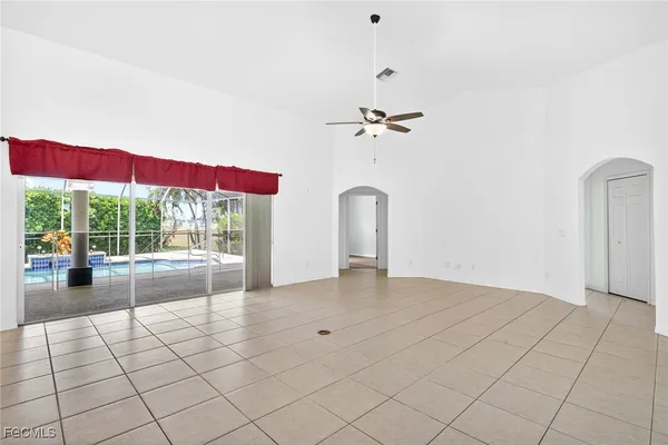 a view of livingroom with furniture wooden floor and fan