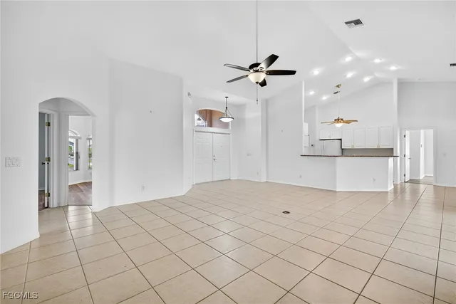 a view of a room with a window and chandelier
