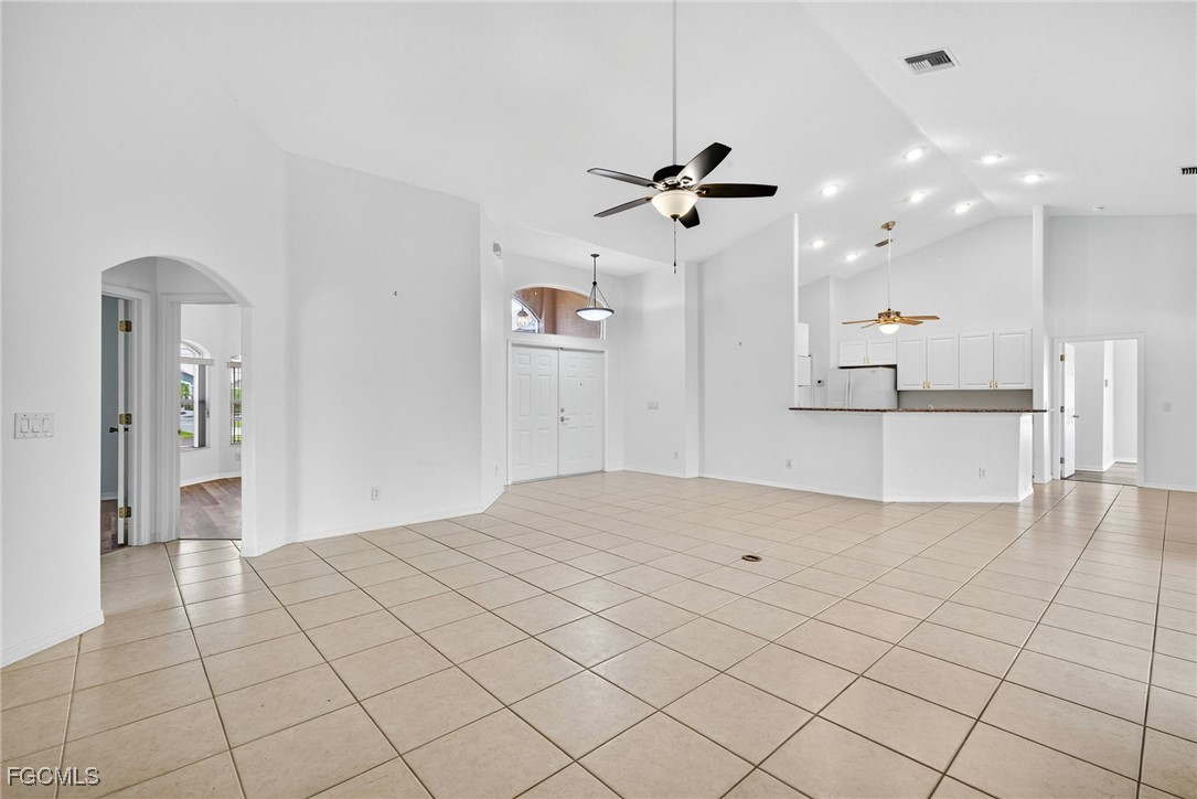 2007 Southwest 43rd Terrace Cape Coral, FL 33914 - Photo 6 of 22 a view of a kitchen with kitchen island stainless steel appliances a sink and cabinets