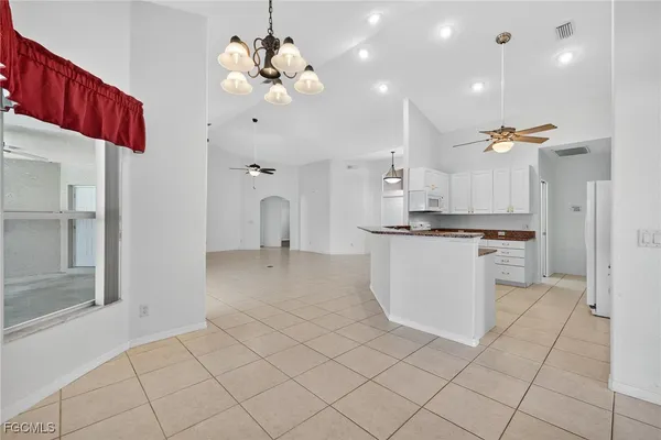 a view of kitchen with center island and stainless steel appliances