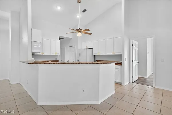 a kitchen that has a sink and a stove