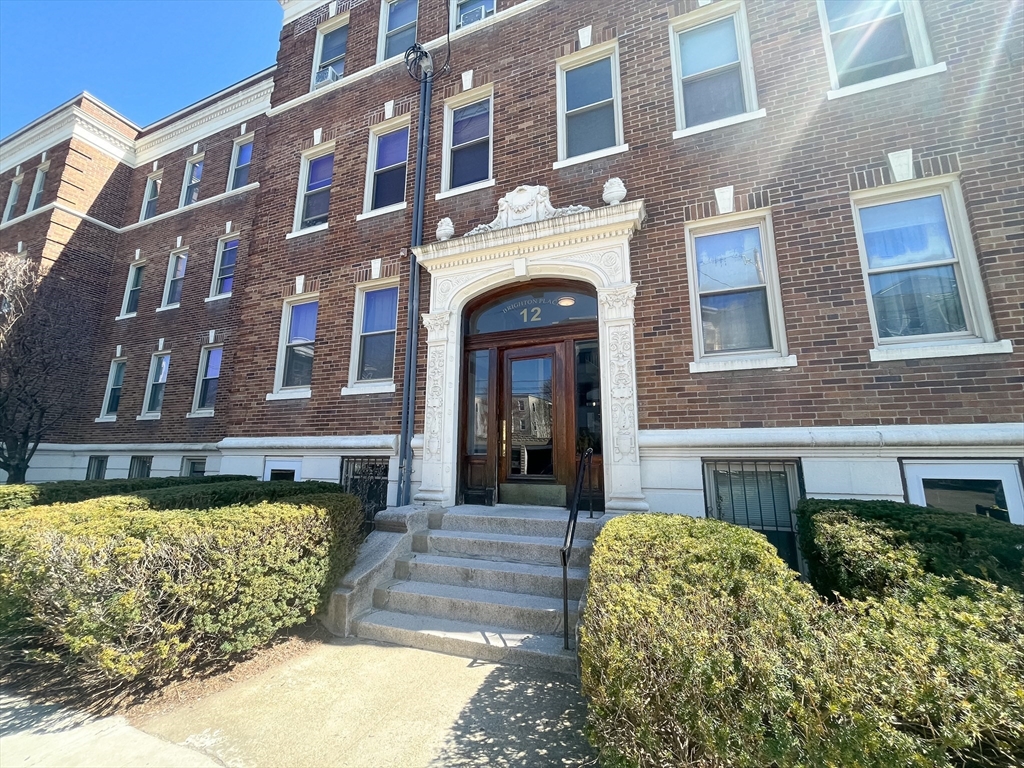 12 Ransom Road, Unit 6 Boston, MA 02135 - Photo 15 of 16 a front view of a building with a garden