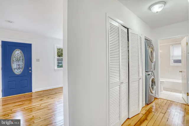 a view of a bathroom with a sink and a mirror