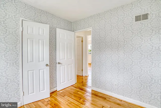 a room with a bed and a window