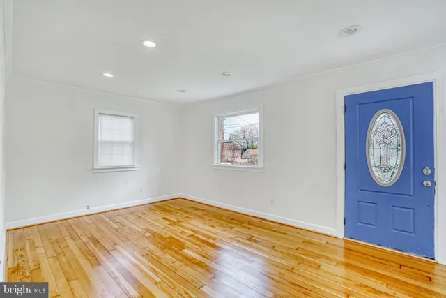 a view of an entryway with wooden floor