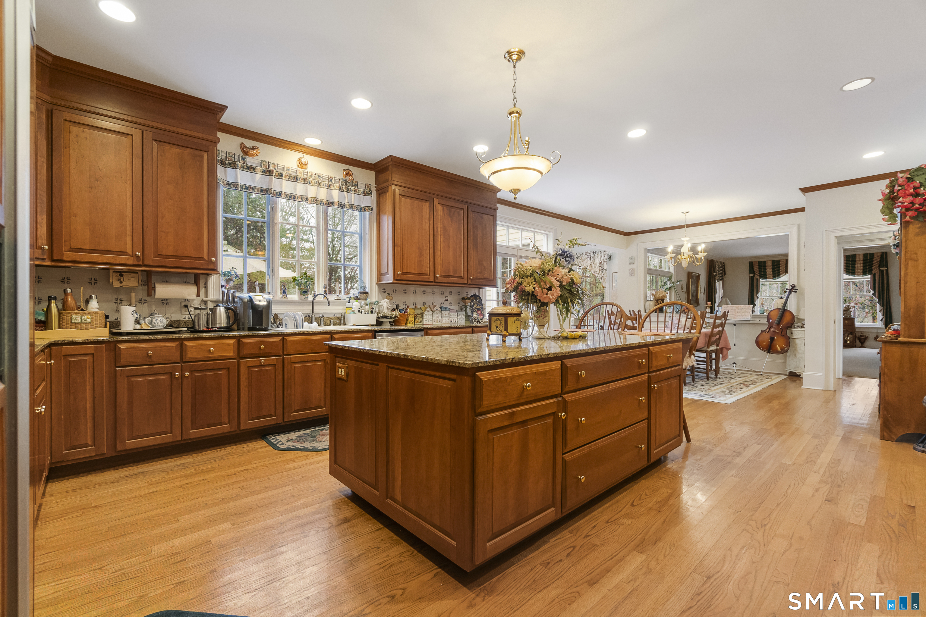 9 Perkins Road Woodbridge, CT 06525 - Photo 11 of 39 a kitchen with stainless steel appliances granite countertop wooden cabinets a sink dishwasher a stove and a refrigerator