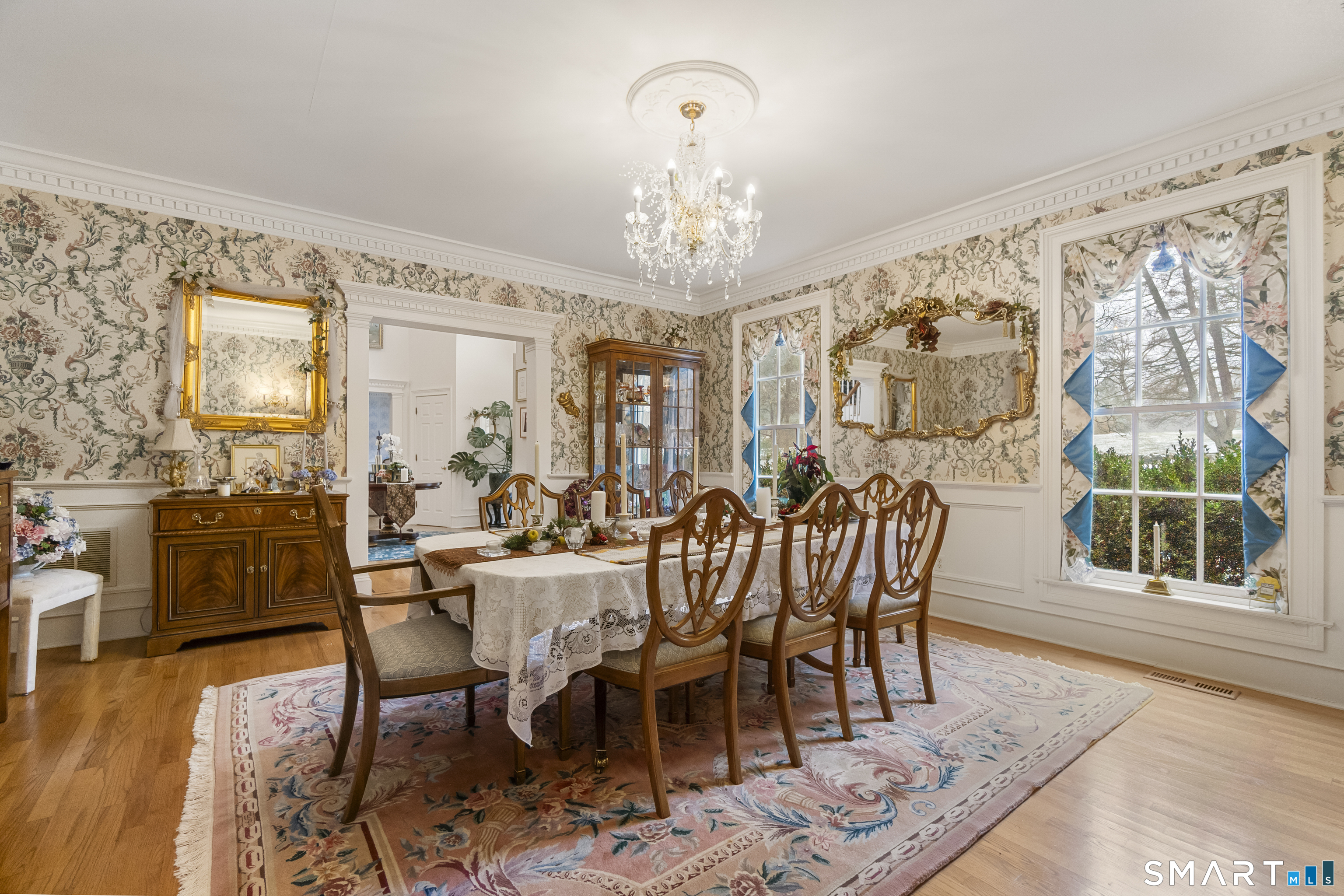 9 Perkins Road Woodbridge, CT 06525 - Photo 13 of 39 a view of a dining room with furniture window and wooden floor