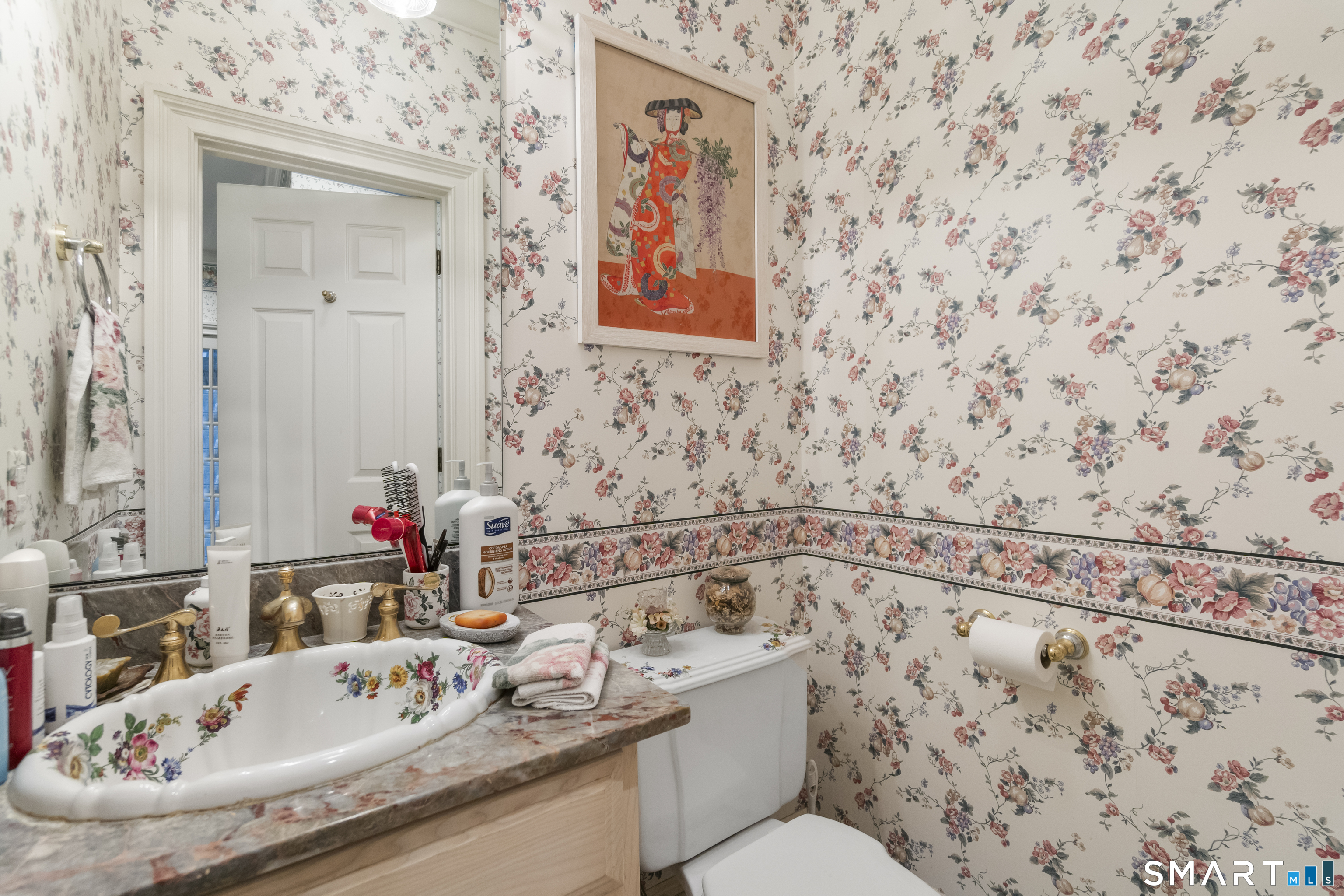 9 Perkins Road Woodbridge, CT 06525 - Photo 25 of 39 a bathroom with a sink and mirror with toilet
