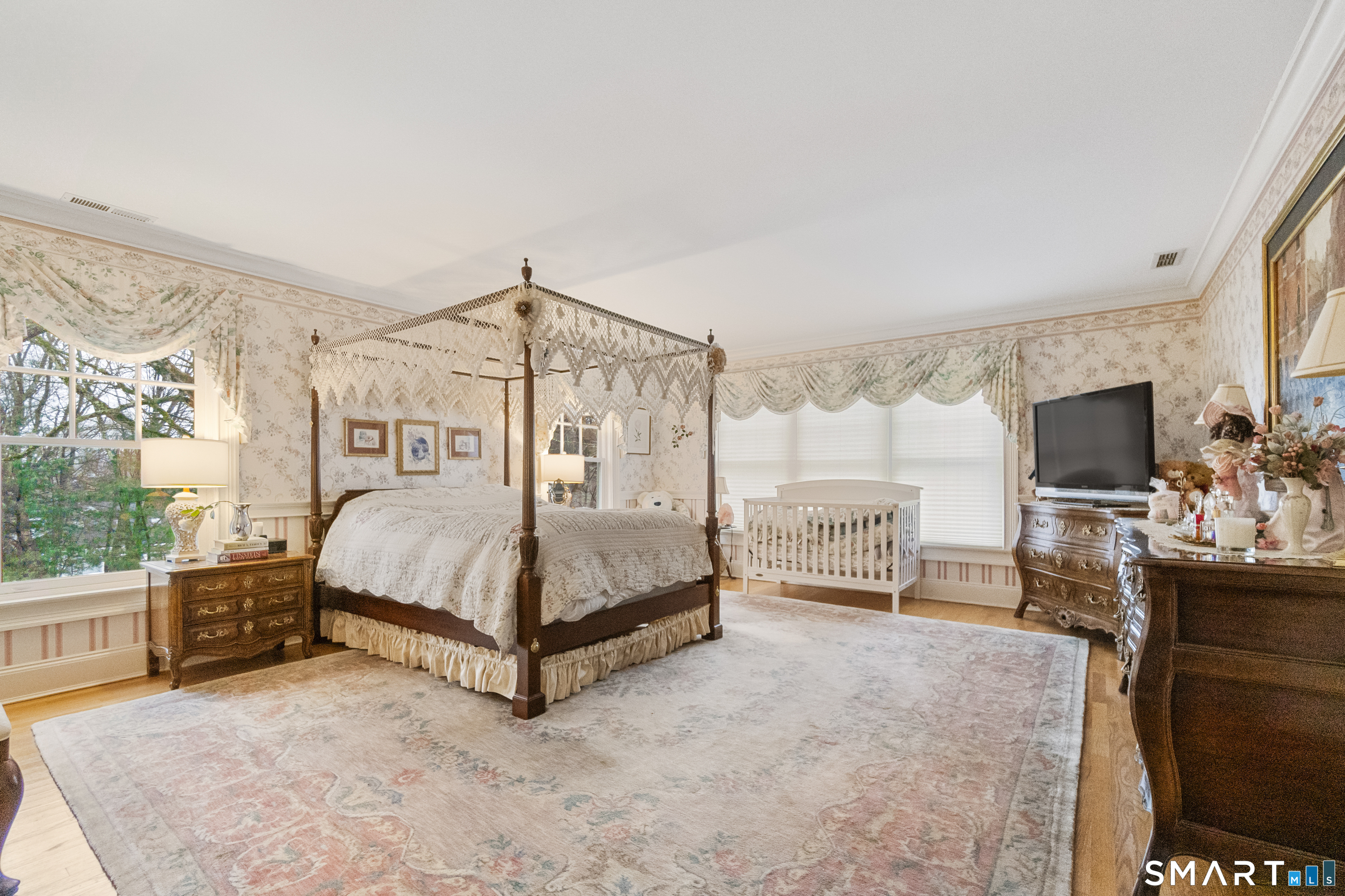 9 Perkins Road Woodbridge, CT 06525 - Photo 28 of 39 a bedroom with a bed and large flat screen tv