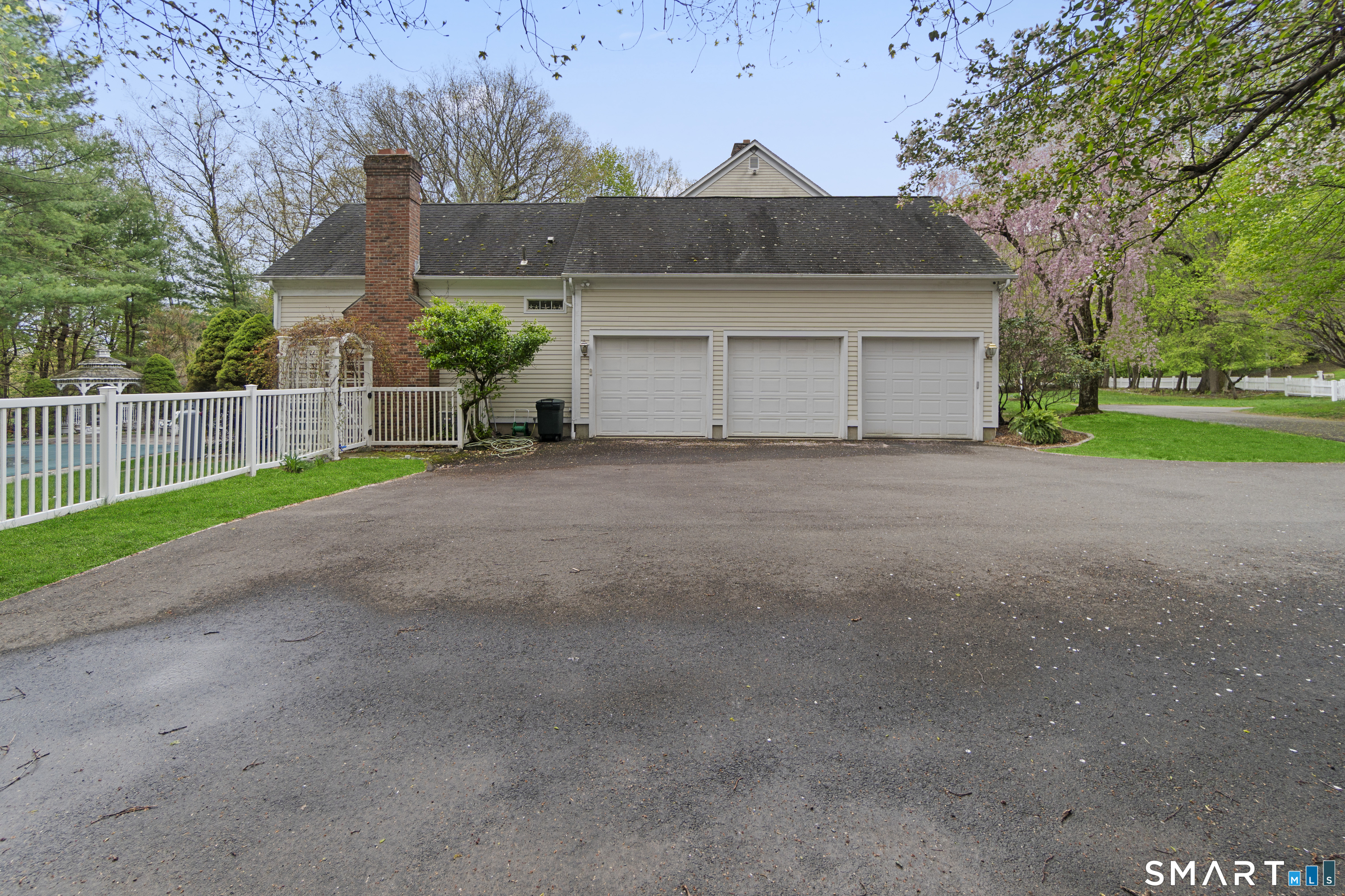 9 Perkins Road Woodbridge, CT 06525 - Photo 3 of 39 a front view of house with yard and trees