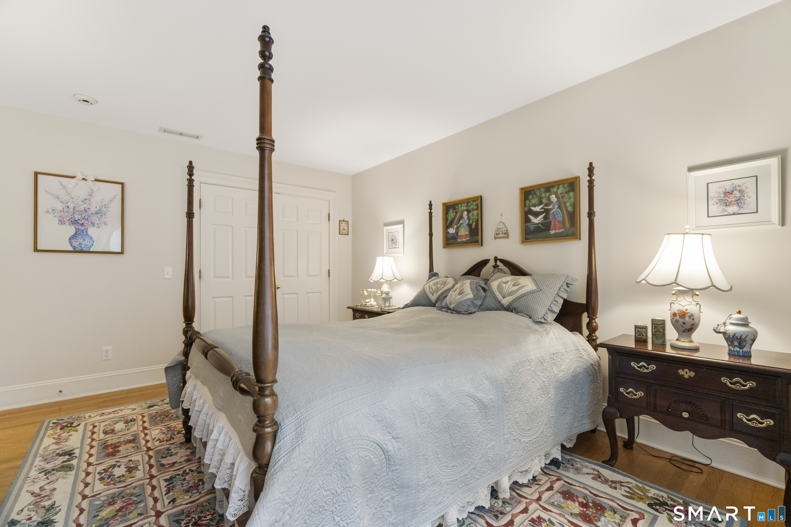 9 Perkins Road Woodbridge, CT 06525 - Photo 35 of 39 a bedroom with a bed and a lamp on dresser