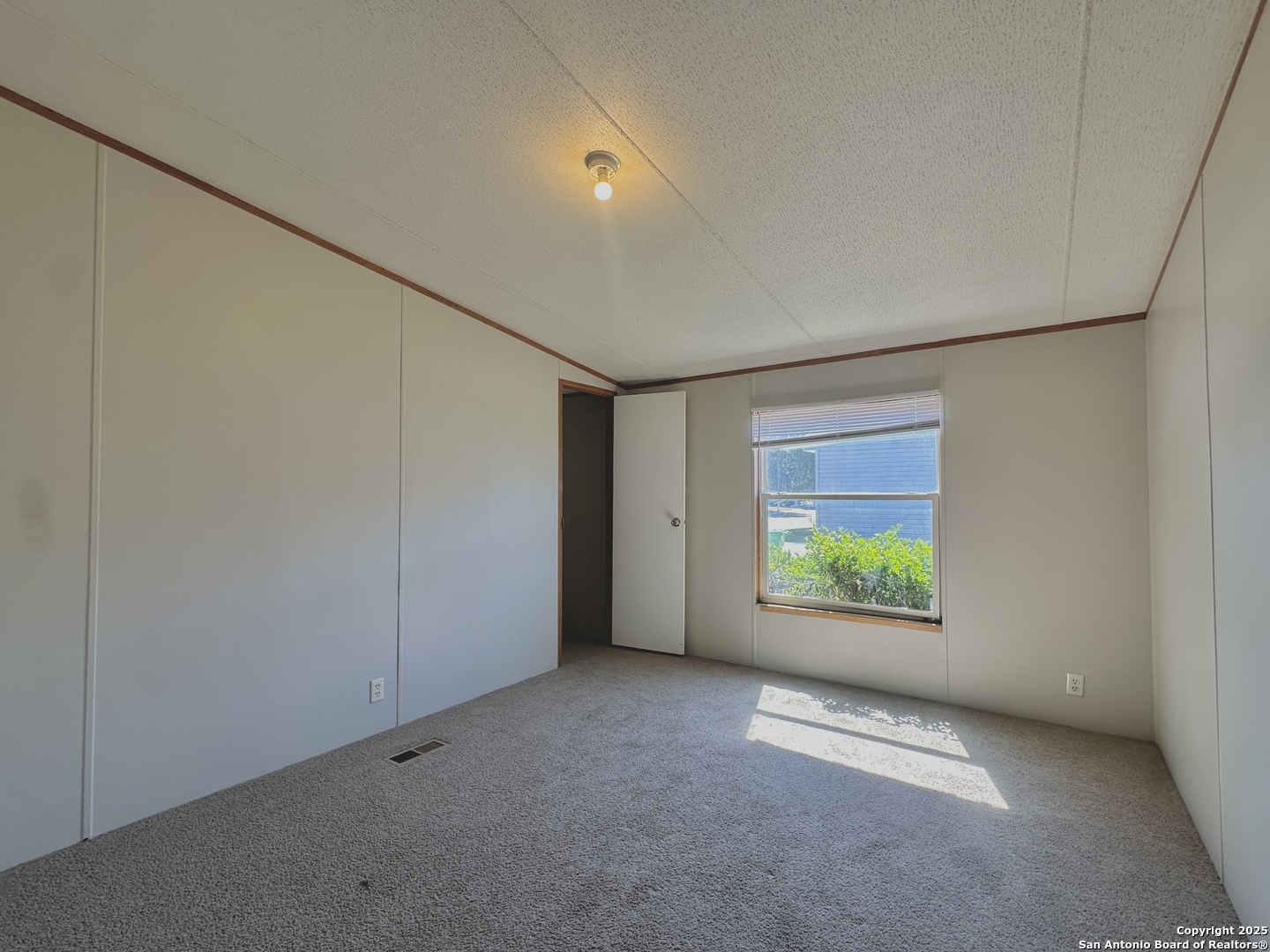 11555 Culebra Road San Antonio, TX 78253 - Photo 11 of 14 an empty room with windows