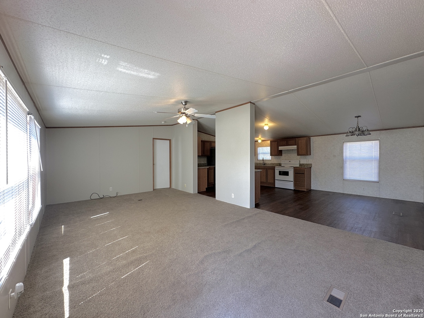 11555 Culebra Road San Antonio, TX 78253 - Photo 2 of 14 a view of a hall with a kitchen