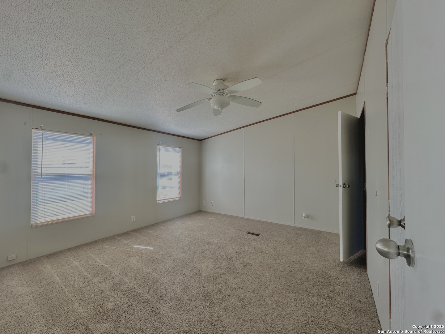 11555 Culebra Road San Antonio, TX 78253 - Photo 5 of 14 an empty room with windows and closet