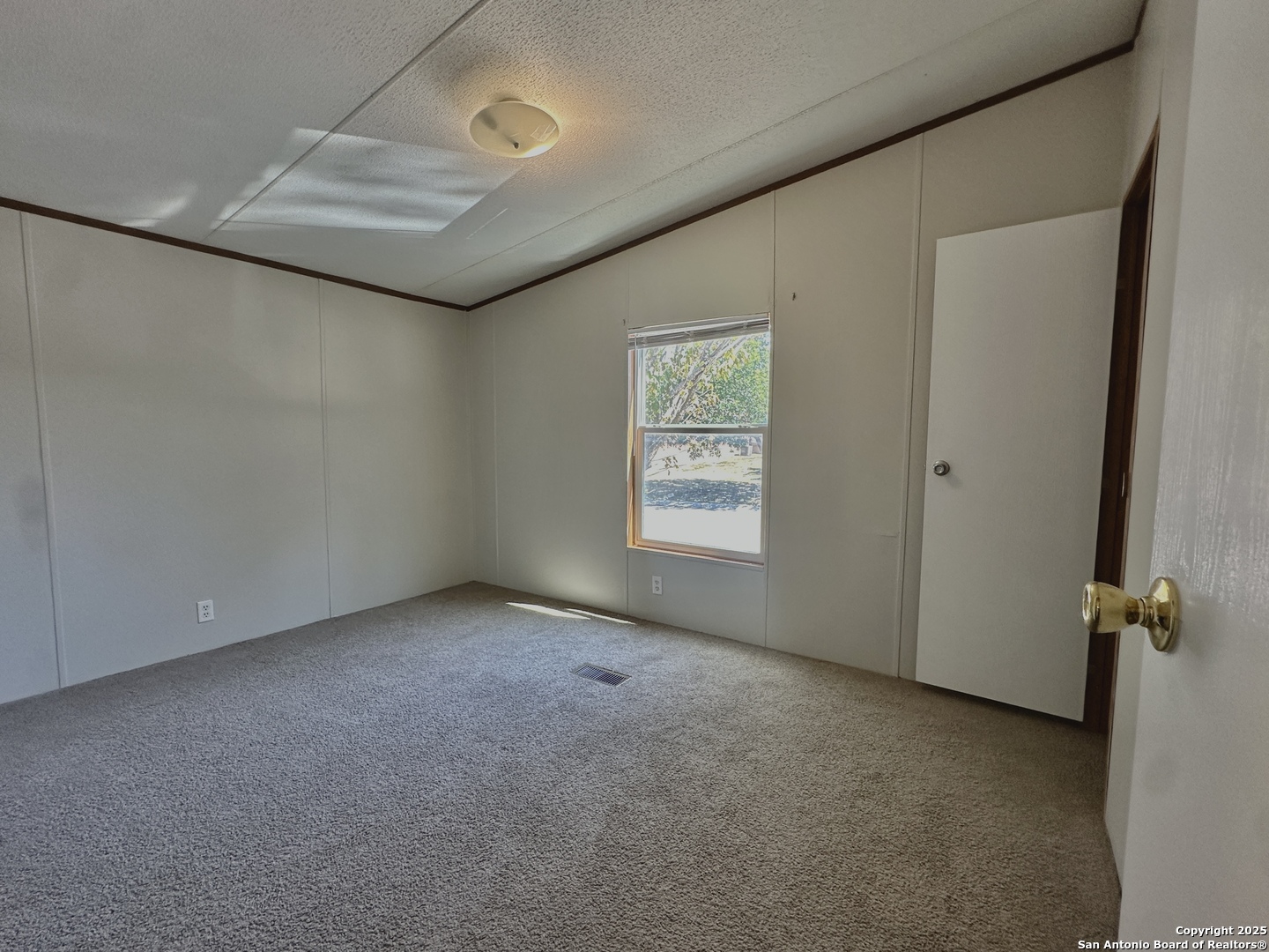 11555 Culebra Road San Antonio, TX 78253 - Photo 9 of 14 an empty room with windows