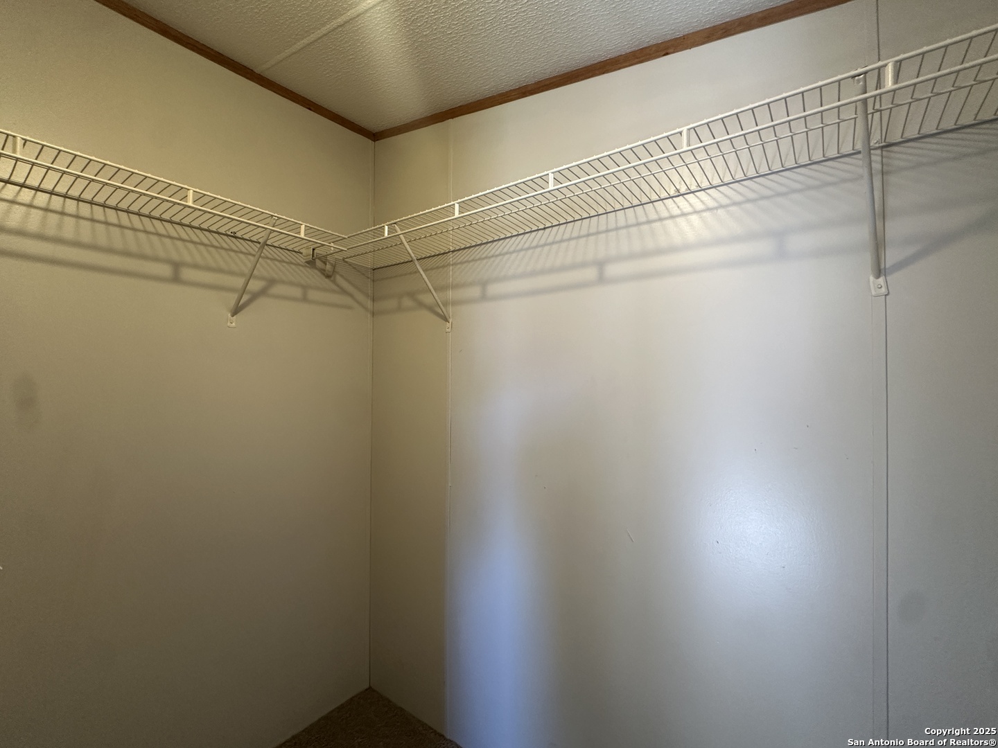 11555 Culebra Road San Antonio, TX 78253 - Photo 10 of 14 a view of a room with racks on the wall