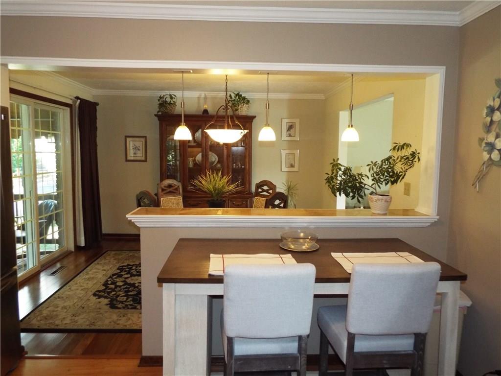 1824 Hassam Road Coraopolis, PA 15108 - Photo 3 of 24 View of dining room from the kitchen. Sliding doors to awning covered deck.