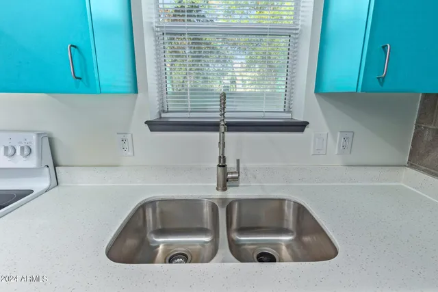 a kitchen with a sink and a window