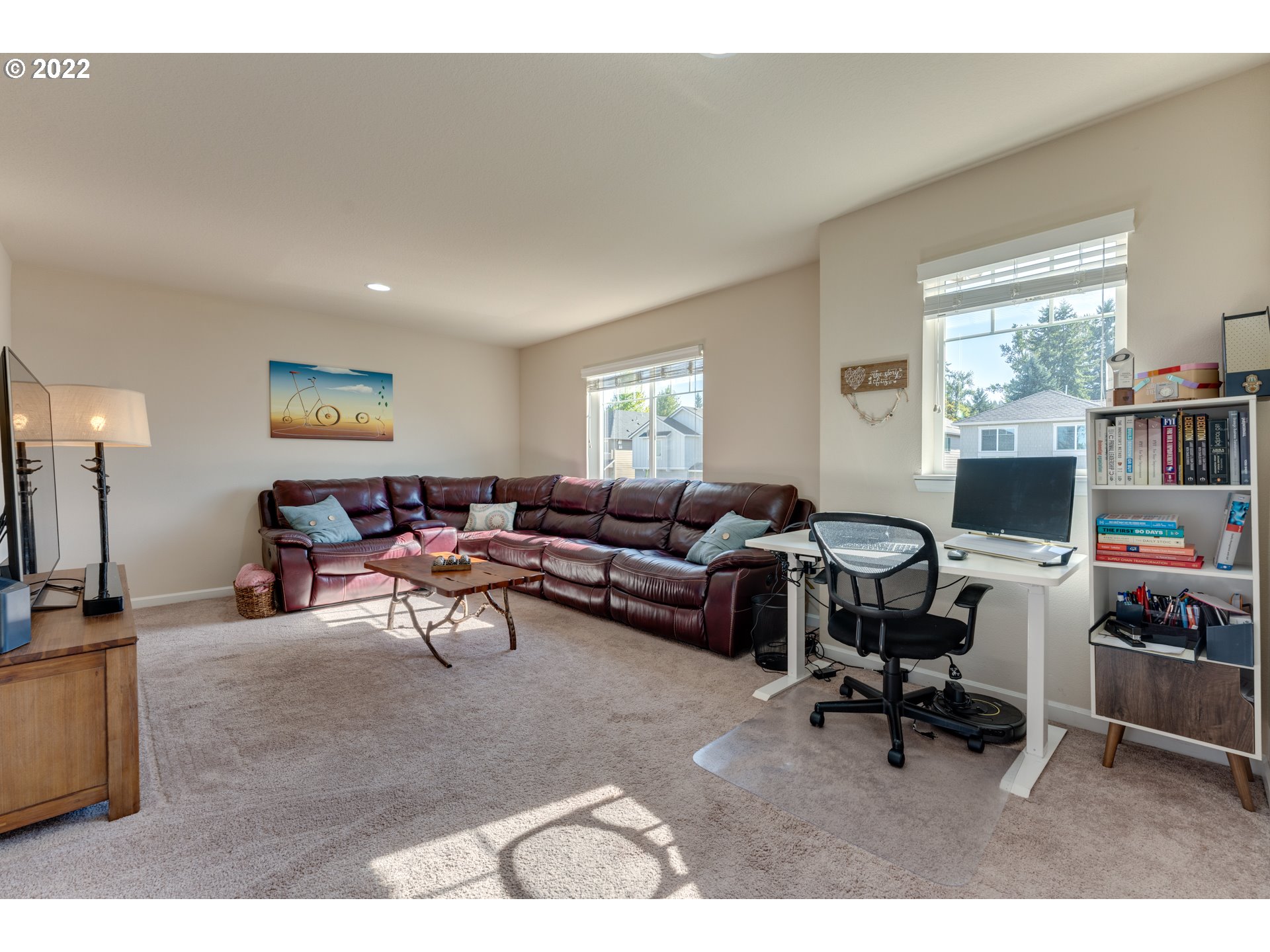 17575 Southeast Pinnacles Street Damascus, OR 97089 - Photo 24 of 32 a living room with furniture a rug and a large window