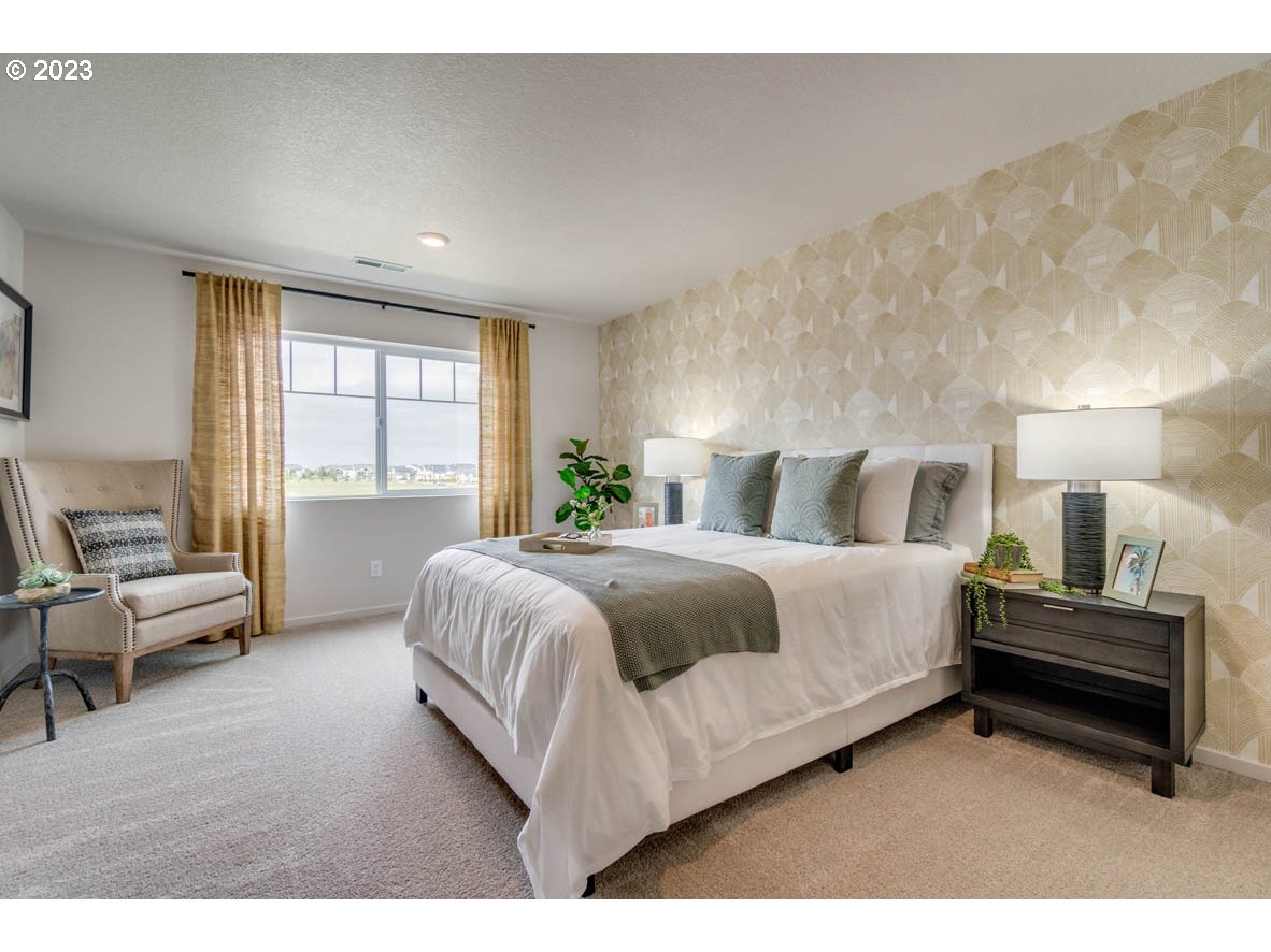 2651 26th Loop Springfield, OR 97477 - Photo 11 of 15 a bedroom with a bed and a large window