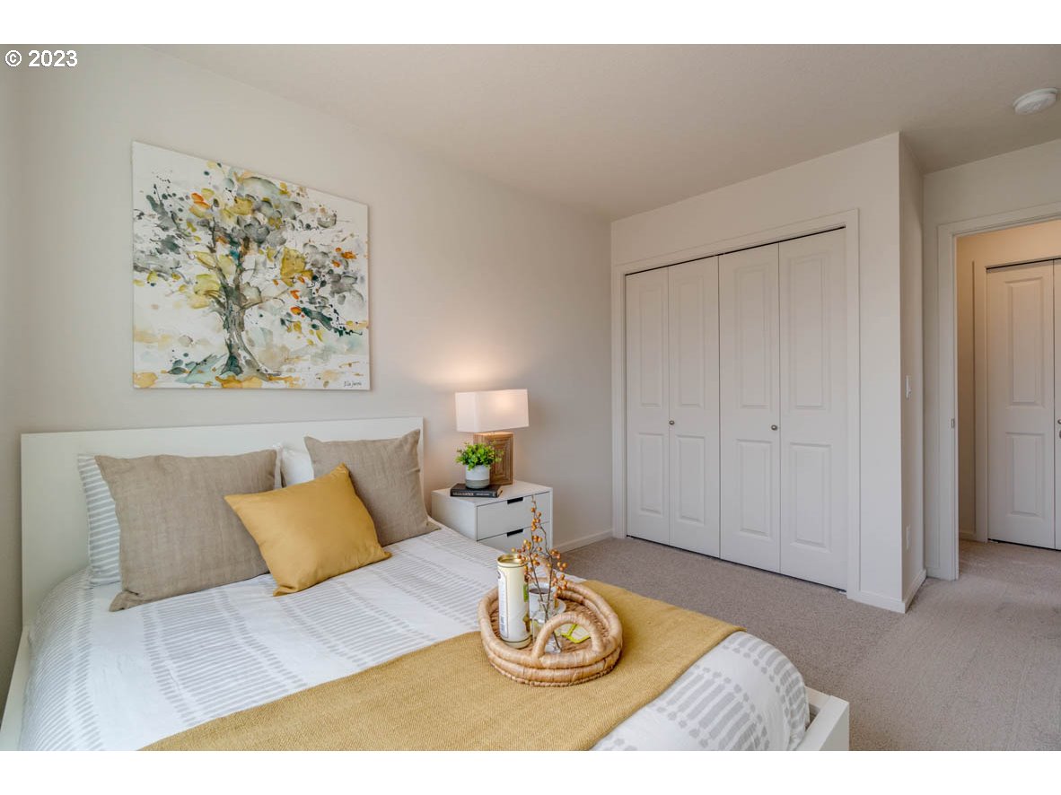 2651 26th Loop Springfield, OR 97477 - Photo 7 of 15 a bed room with a bed and a painting on the wall