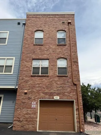 a building view with a brick wall