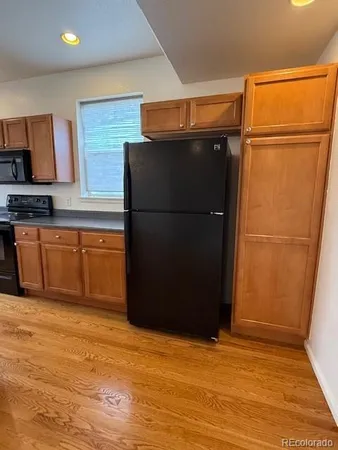 a view of kitchen with wooden floor
