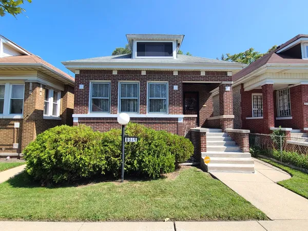 front view of a house with a yard