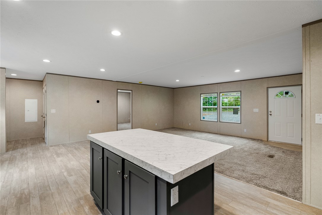 419 Austin Drive Anderson, SC 29624 - Photo 19 of 36 Bright, open concept living area featuring a central island and abundant natural light.