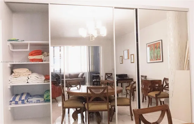 a kitchen with stainless steel appliances kitchen island granite countertop a stove and a refrigerator