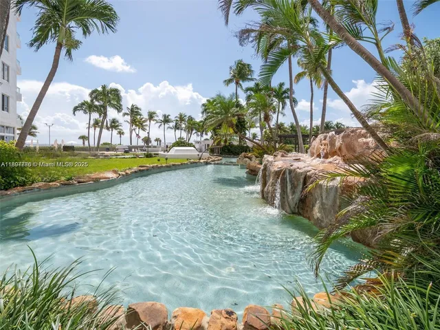 a view of a palm trees front of house