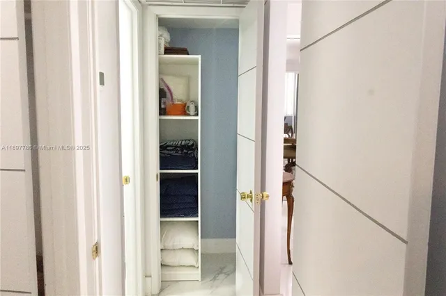 a view of a bathroom from a hallway