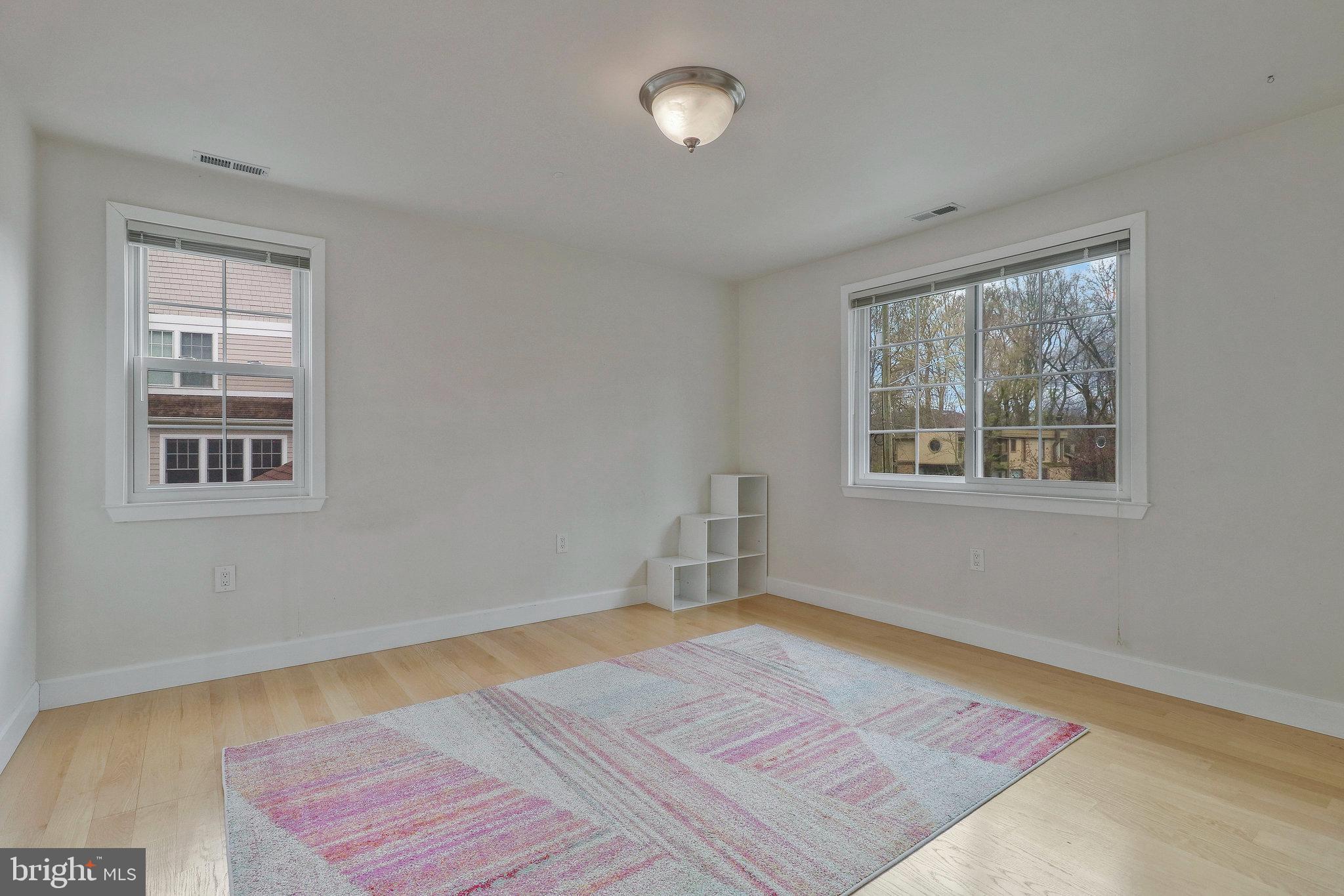 8543 Howell Road Bethesda, MD 20817 - Photo 17 of 24 a view of a room with wooden floor and window