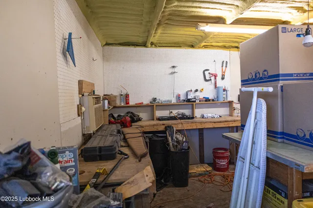 a room with stainless steel appliances a sink and cabinets