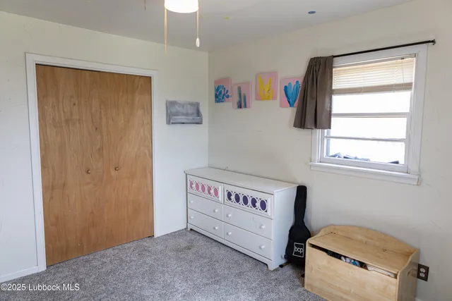 a room with a bed and a window