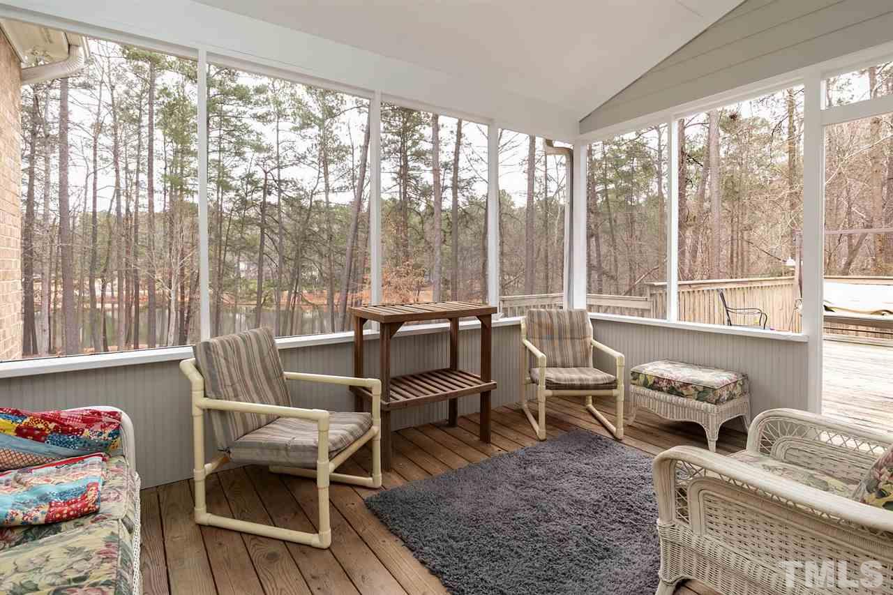 5912 Dean Avenue Raleigh, NC 27616 - Photo 14 of 24 a living room with furniture and a floor to ceiling window