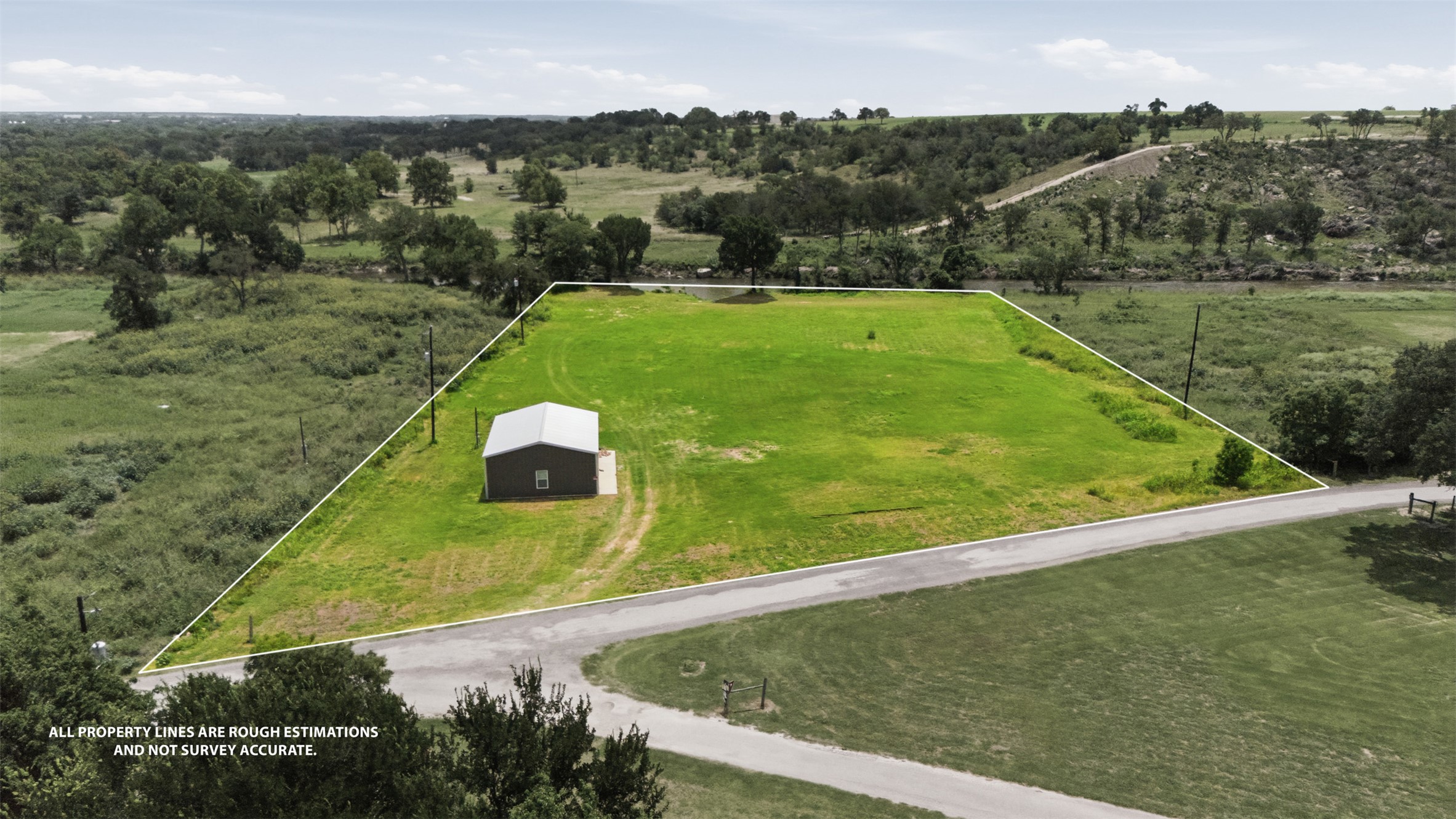 2043 Fm 971 Georgetown, TX 78626 - Photo 1 of 12 A sprawling greenspace with a utility building offers expansive views and development potential.