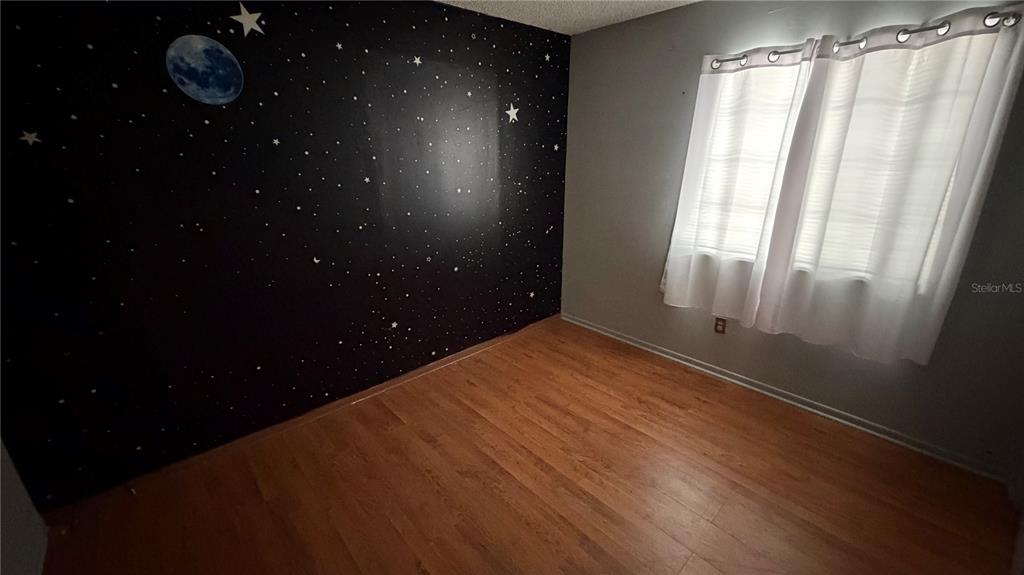 107 Eliam Road Melrose, FL 32666 - Photo 26 of 62 a room with a window and a ceiling fan