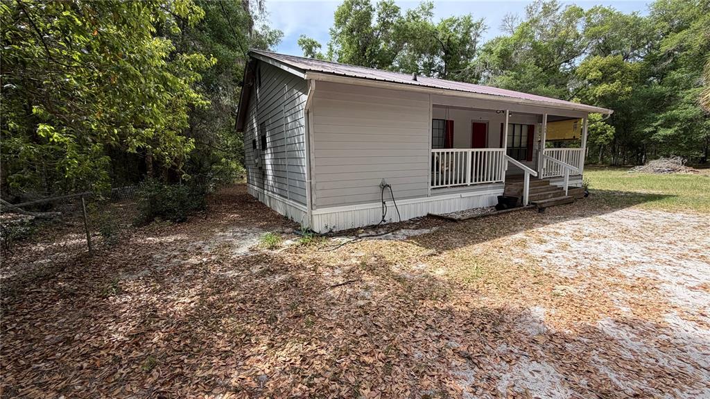 107 Eliam Road Melrose, FL 32666 - Photo 6 of 62 a view of a house with a yard