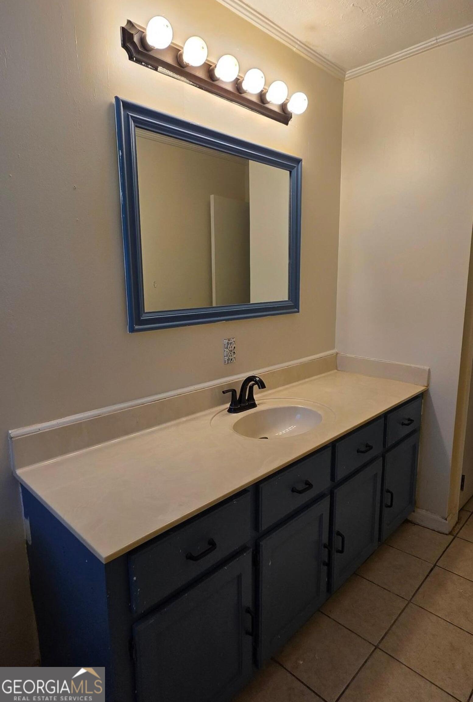 110 Lee Street Centerville, GA 31028 - Photo 11 of 16 a bathroom with a sink vanity and a mirror