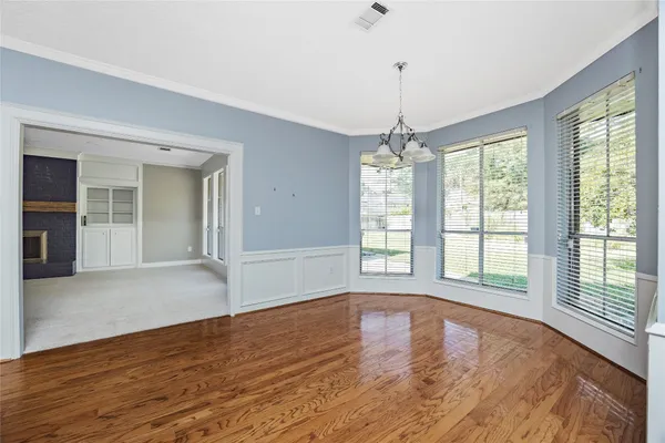 a view of livingroom with window hardwood floor and ceiling fan