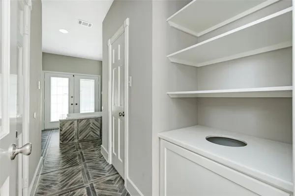 a spacious bathroom with a granite countertop sink mirror and a bathtub