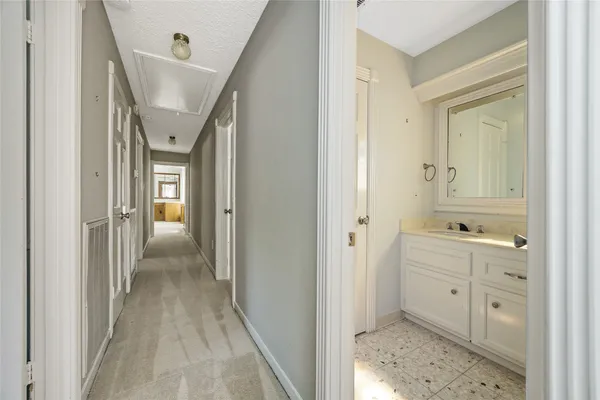 a bathroom with a sink a toilet and window