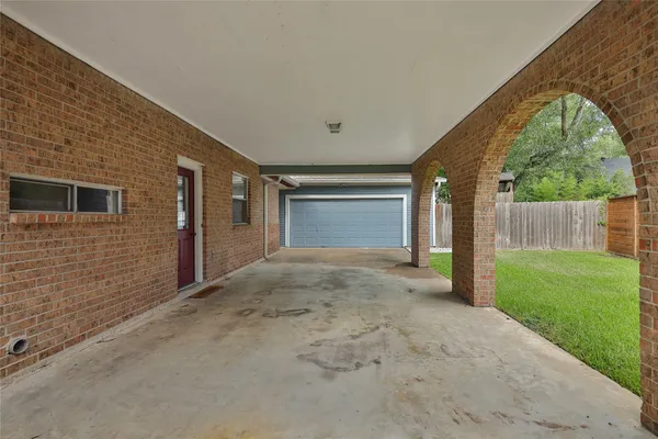 a view of a house with a yard and sitting area