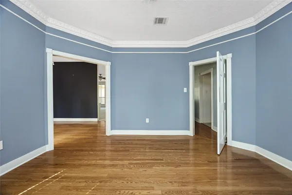 a view of hallway with wooden floor